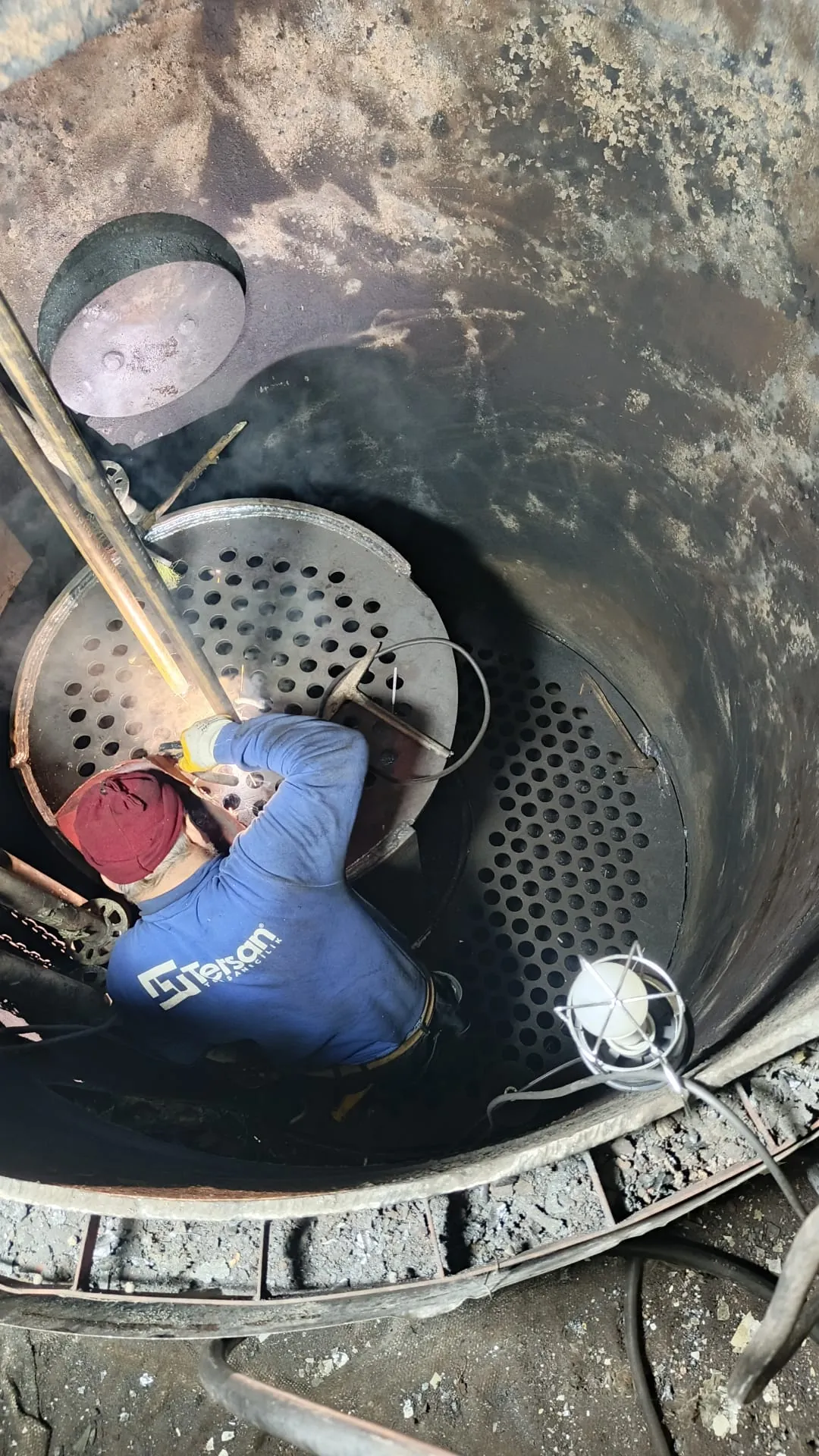 Working in the confined space inside a boiler