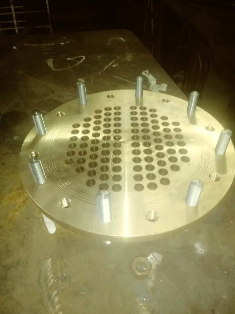 Machined tube sheet with studs