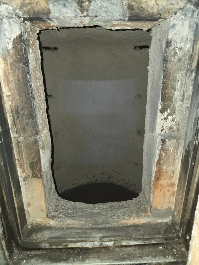 Before removal, damage visible on the refractory surface