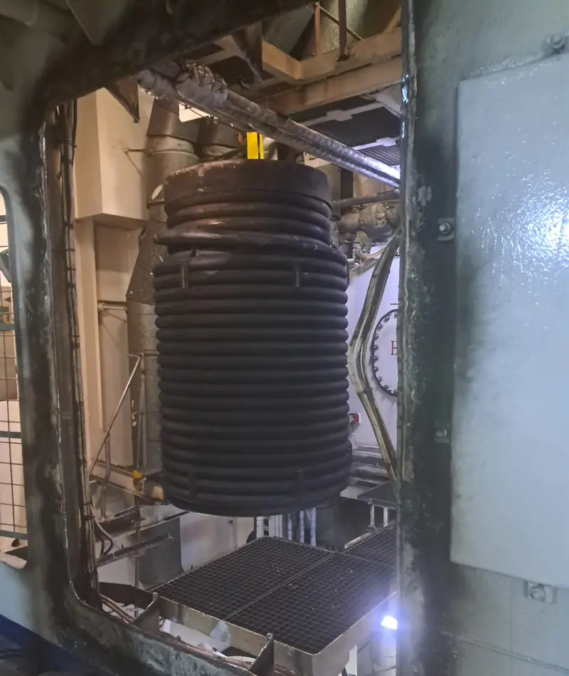 Lowering the coil into the boiler
